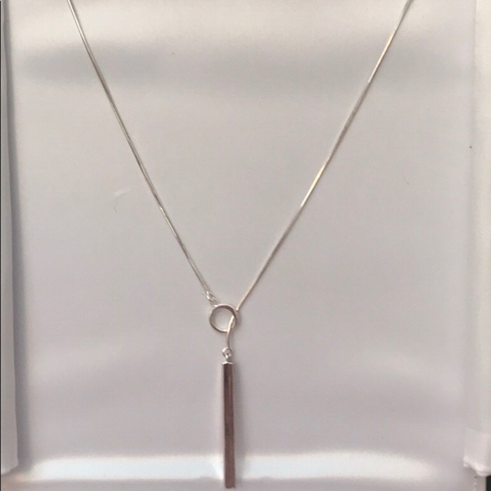 Free hanging silver necklace.